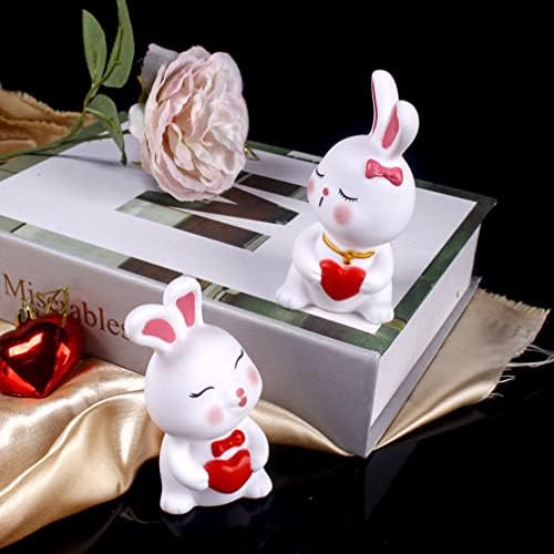 Figurine de iepuraș de la Toyvian Mini Bunny 4pcs Valentines Day Bunny cu statui de inimă Iepuri Iepuraș Cupcake Toppers decorațiuni